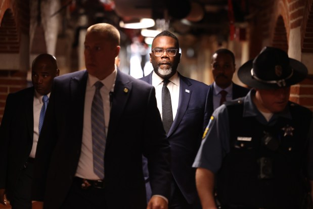 Chicago Mayor Brandon Johnson walks to the Blue Room to talk to the media before visiting lawmakers at the Illinois State Capitol, April 30, 2025. (Brian Cassella/Chicago Tribune)