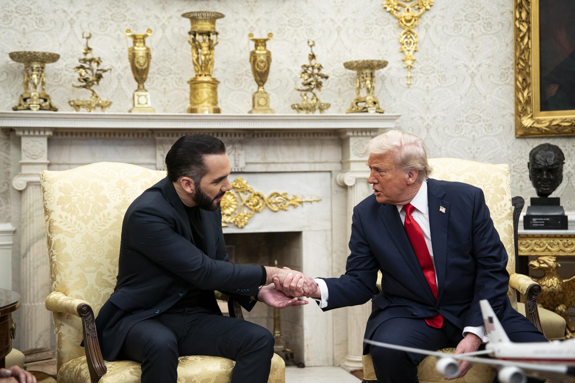 President Donald Trump shakes hands with Nayib Bukele, El Salvador's president