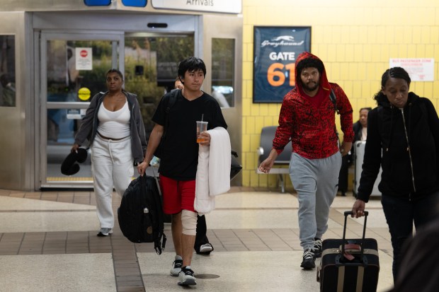 Queens high school student Derlis Snaider Chusin Toaquiza walks from a bus at the Port Authority Bus Terminal after being released from ICE custody on Friday.