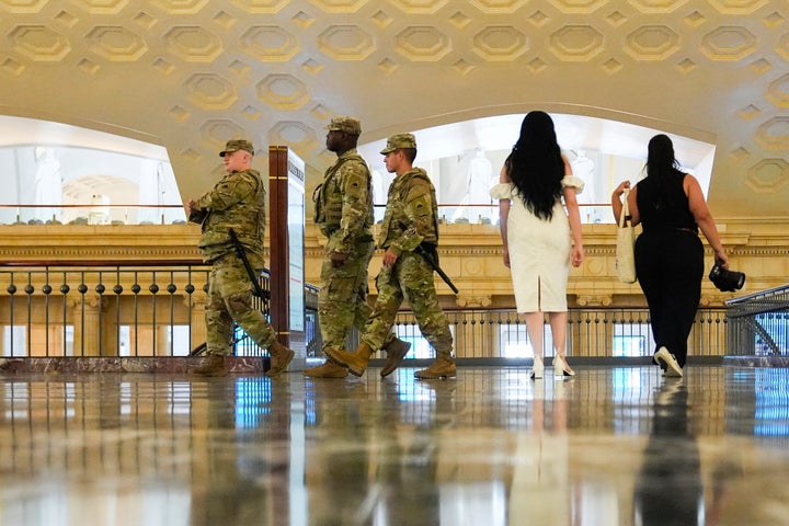 District of Columbia National Guard soldiers patrol inside Union Station, Saturday, Aug. 16, 2025, in Washington. (AP Photo/Julia Demaree Nikhinson)