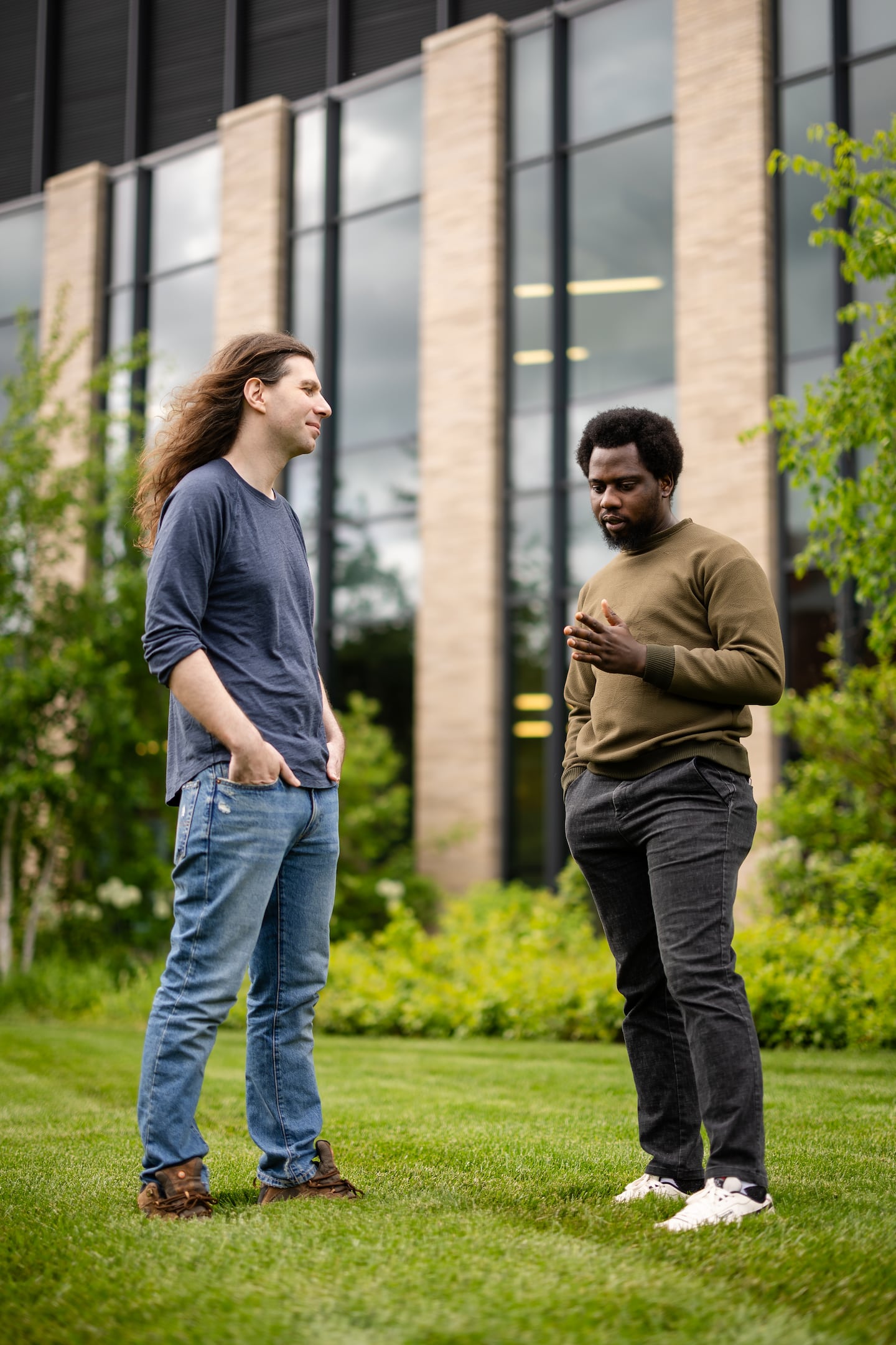 John Arigbede (right) talked with Ian Tincknell on campus at UMass Amherst last Saturday. Arigbede and Tincknell are respectively president and vice president of the graduate student government, which represents nearly 8,000 graduate students, around 36 percent of whom are international, coming from 117 different countries.