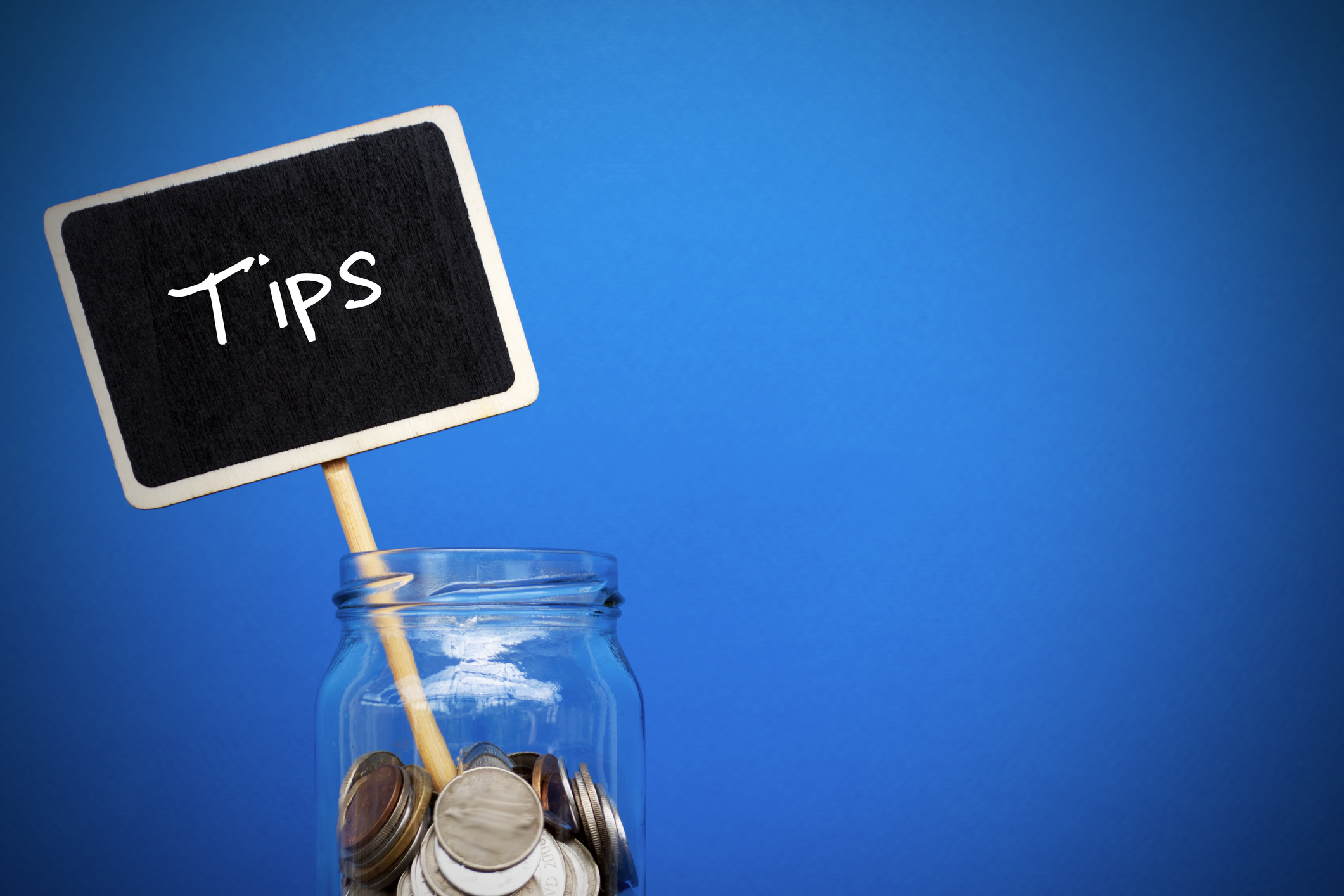 the word "tips" coming out of a tip jar