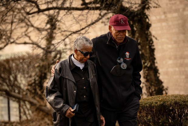 Chicago radio executive Abe Thompson strolls with the Rev. Janette Wilson, longtime Rainbow/PUSH Coalition leadership member and senior adviser to the Rev. Jesse Jackson, outside headquarters following his death, Feb. 17, 2026. (E. Jason Wambsgans/Chicago Tribune)