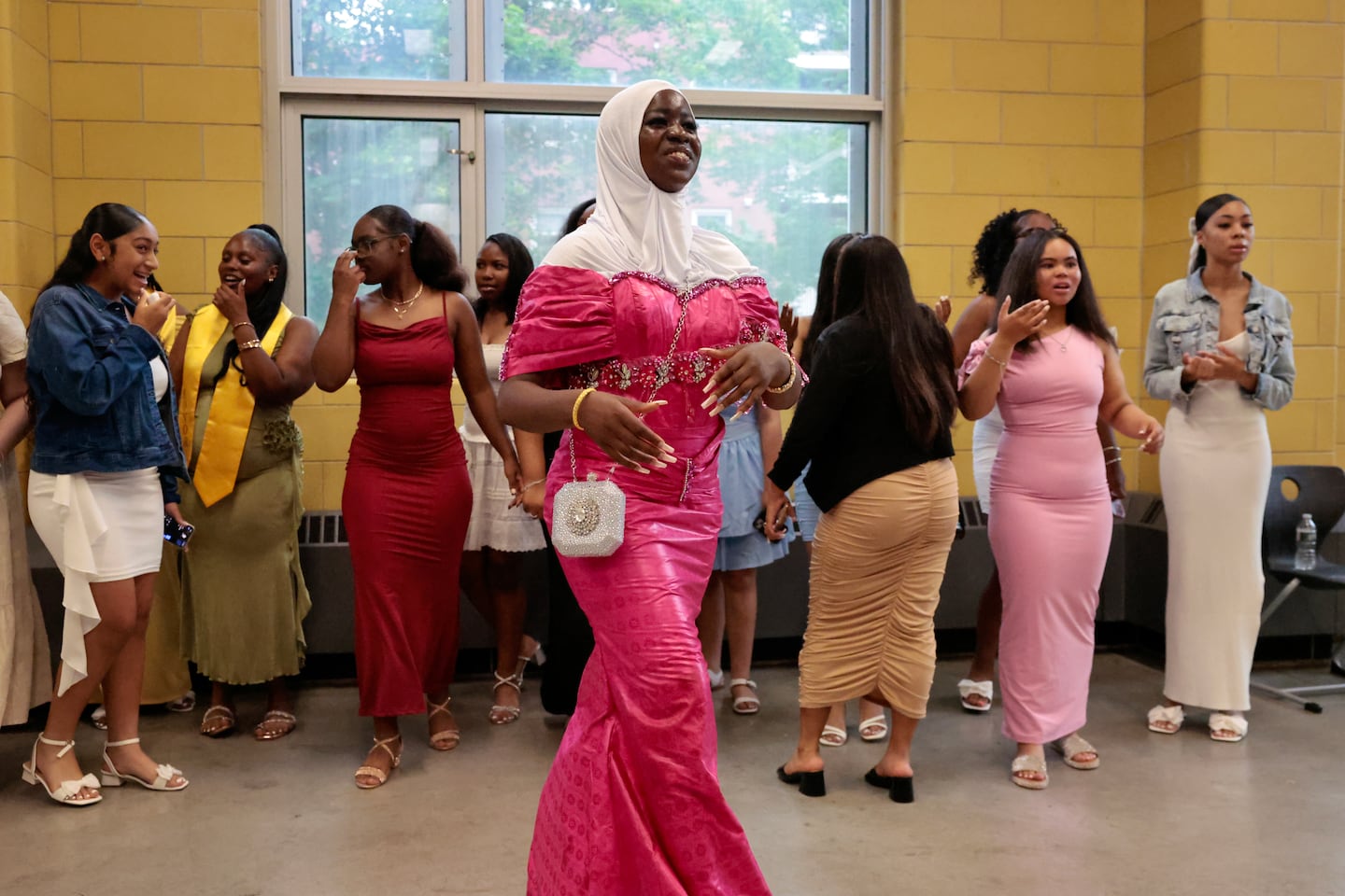 Eighth-grader Bendu Sanoe joined her classmates before the Frederick's promotion ceremony at the Albert D. Holland High School of Technology in Boston on June 18.