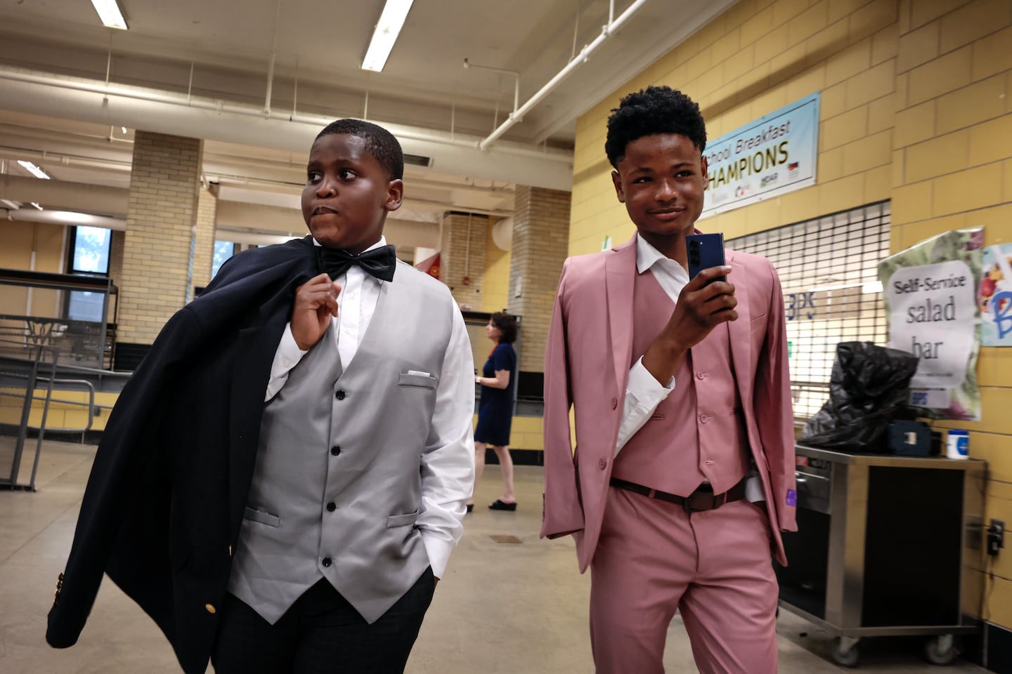 Eighth-graders Alexis Pierre and Cyrus Dorzelma arrived for the Lilla G. Frederick Pilot Middle School promotion ceremony as they move on to high school on June 18.