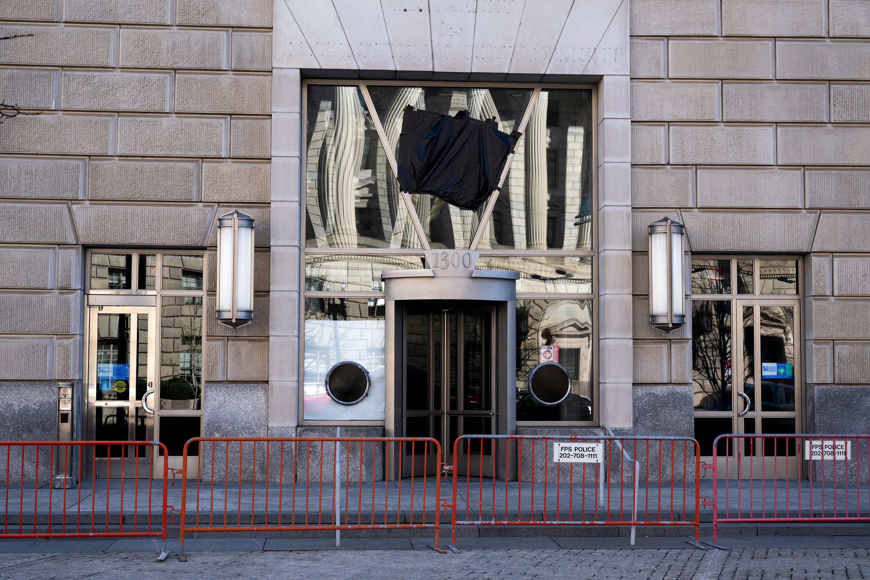 The entrance to the now shuttered USAID office can be seen as black plastic covers a USAID sign at the Ronald Reagan Building and International Trade Center in Washington, DC on April 1.