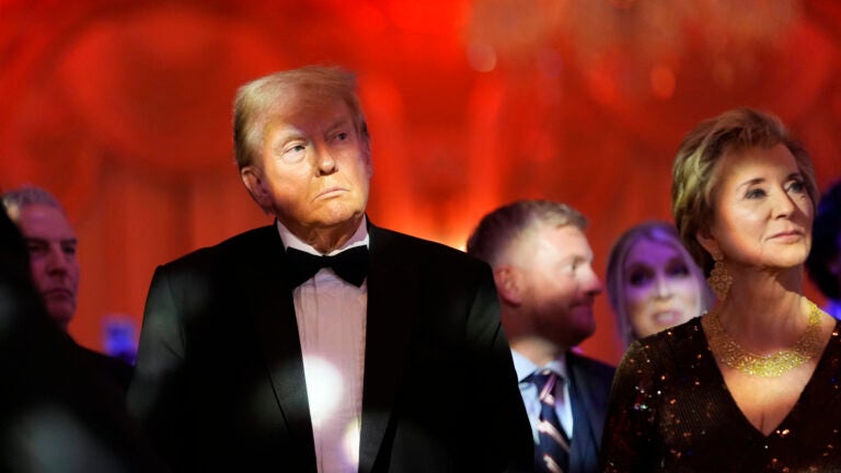 President-elect Donald Trump listens with Linda McMahon.