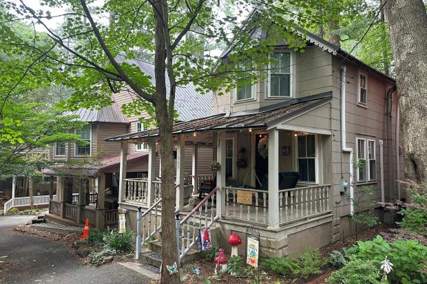 Cottages in the town of Mount Gretna, Pa., shown Wednesday, Aug. 6, 2025, spring to life every summer with people who spend their leisure time in activities such as cooking lessons, nature walks, yoga, professorial lectures, music and plays. (AP Photo/Mark Scolforo)