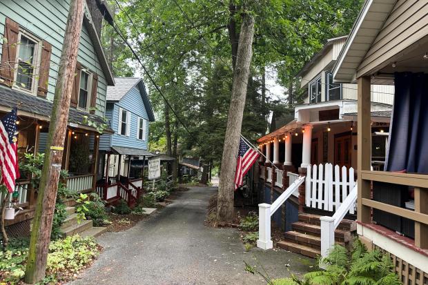 Cottages in the town of Mount Gretna, Pa., shown Wednesday, Aug. 6, 2025, spring to life every summer with people who spend their leisure time engaged in activities such as cooking lessons, nature walks, yoga, professorial lectures, music and plays. (AP Photo/Mark Scolforo)