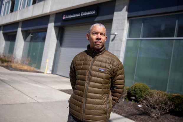 Dr. Thomas Fisher stands outside the University of Chicago Medicine Adult Emergency Room on March 27, 2022. (Erin Hooley/Chicago Tribune)