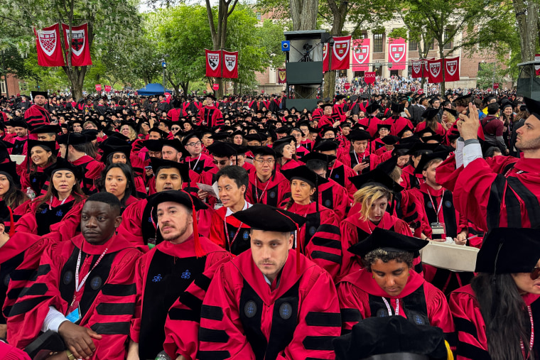 Image: Graduates gather as they attend commencement ceremony at Harvard University