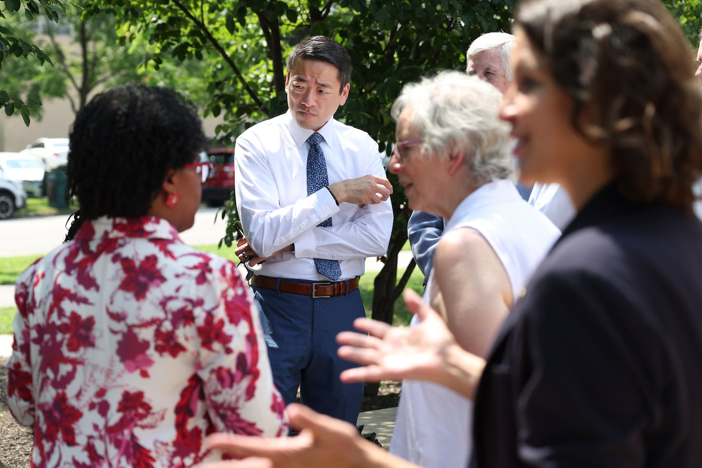 Texas State Rep. Gene Wu, D-Houston (center) talked to Democrat politicians from Indiana, in Chicago on Wednesday before other Texas politicians arrived for a press conference.