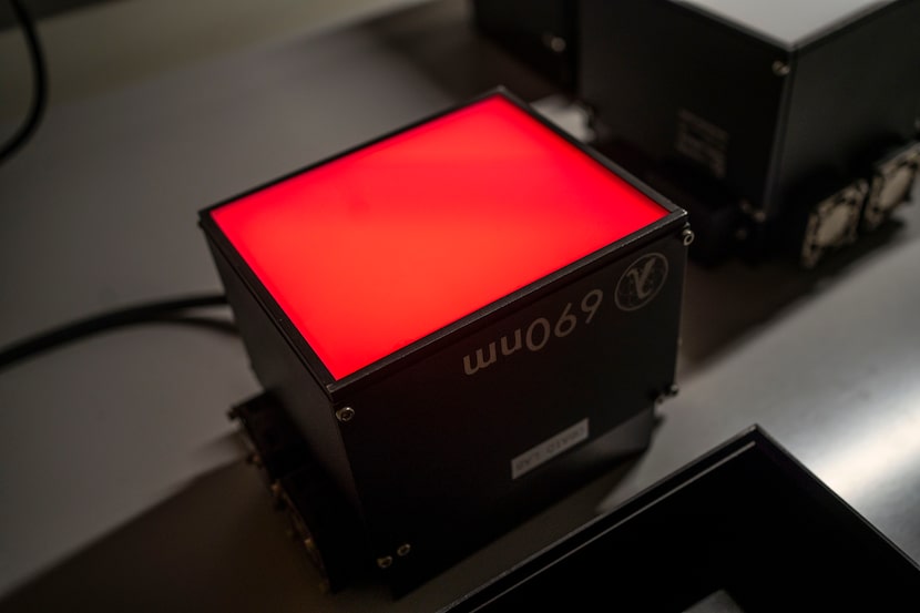 A close-up of an LED photoirradiation device, which emits specific wavelengths of light. The...