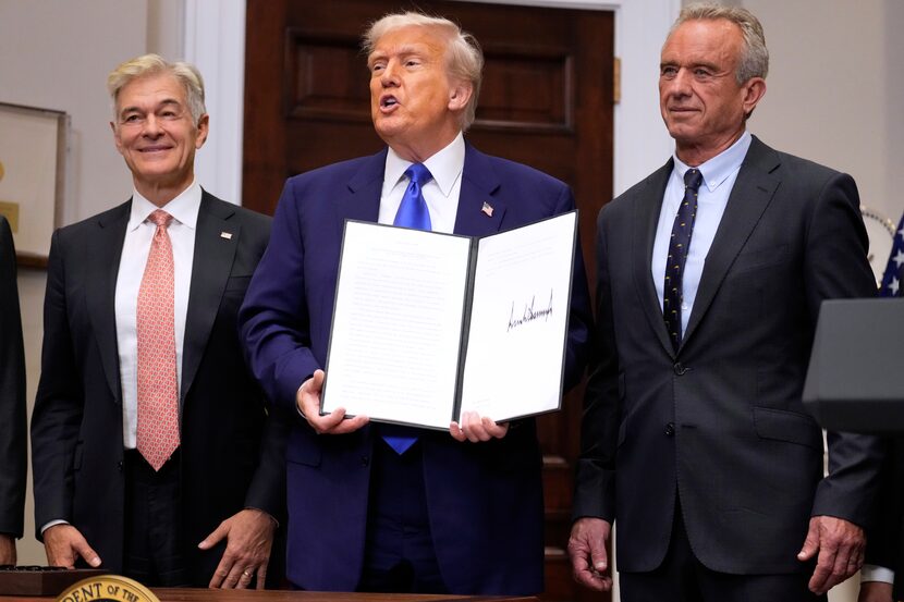 President Donald Trump, with Dr. Mehmet Oz (left), head of the Centers for Medicare &...