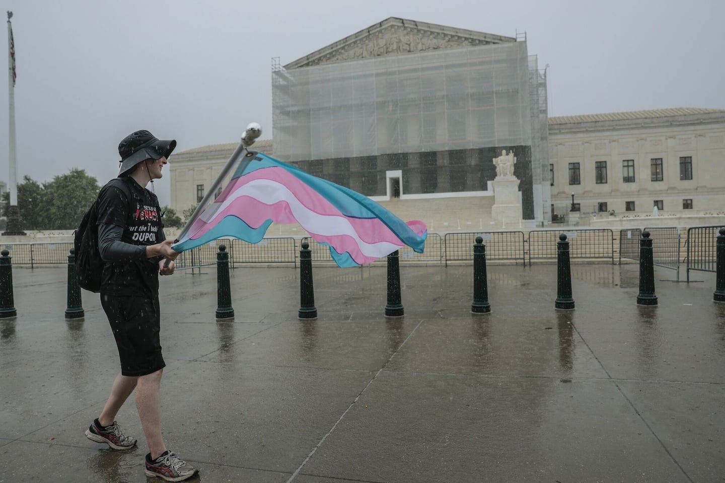 A protester waved a transgender pride flag outside the Supreme Court on June 18.