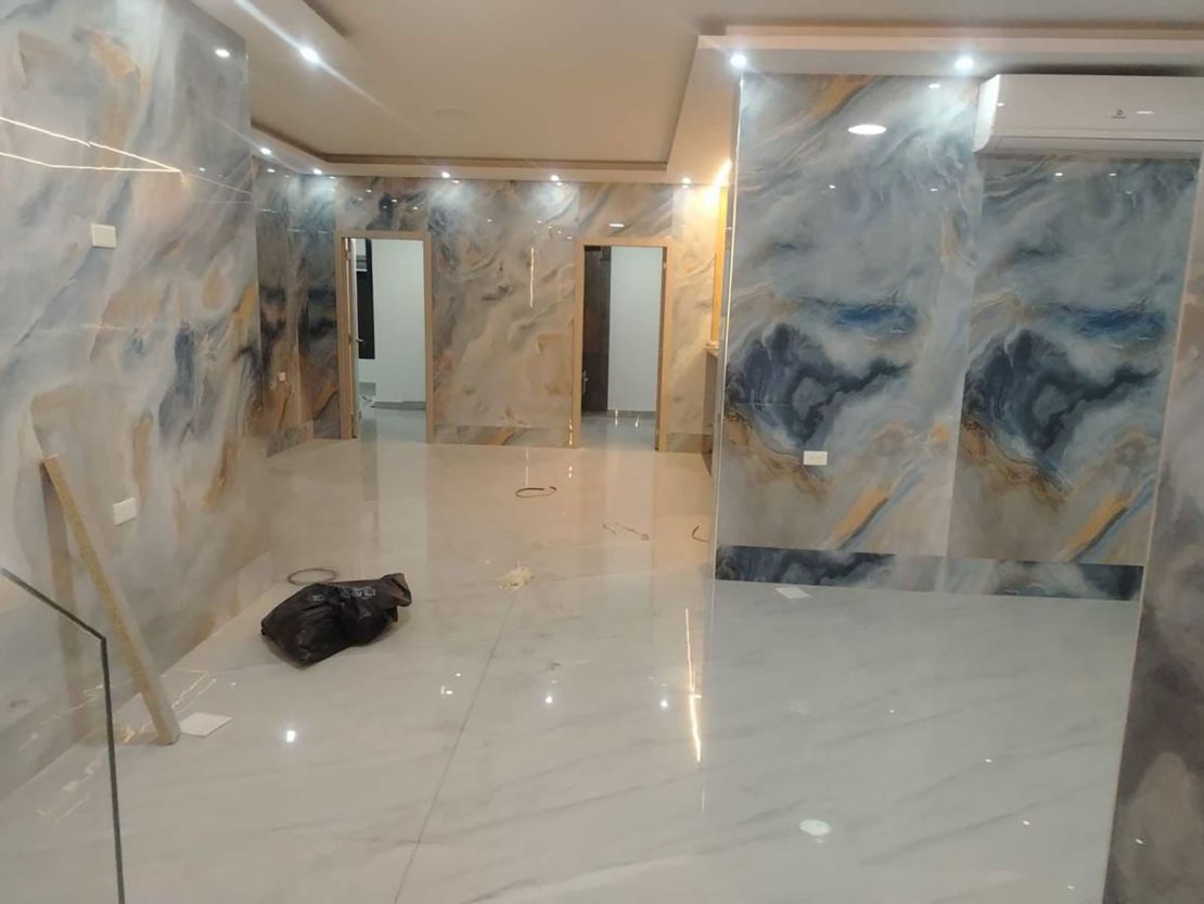 The house was fully equipped and featured a pool, a gym, appliances, a game room, marble-like walls, and other features that indicated the property was still under construction.