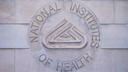 The National Institutes of Health logo is seen at the NIH headquarters in Bethesda, Maryland, on May 10.