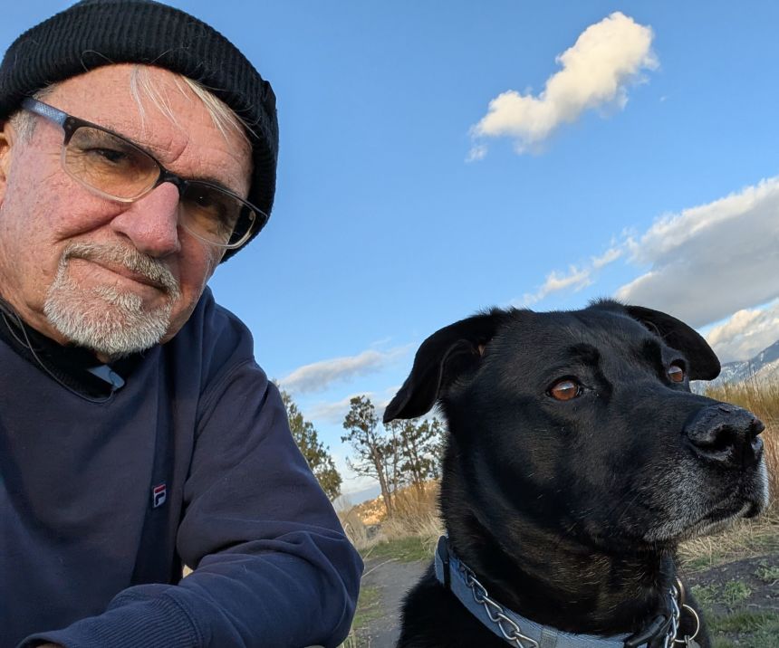 Mike Etchamendy of Big Bear Lake, California, with his dog, Bear. Etchamendy says he owes 10 years of his life to treatment by National Cancer Institute doctors and opposes cuts to the institute’s budget. (Mike Etchamendy)