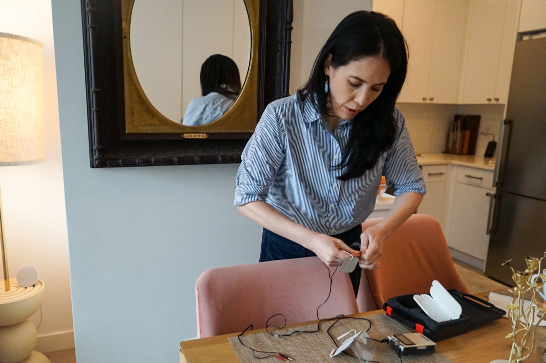 Sophia Bassan has endured post-mastectomy pain syndrome, or PMPS, which is estimated to affect thousands of U.S. women each year. With no clear treatment, Bassan and others have experimented with options such as the nerve stimulation machine pictured here.
