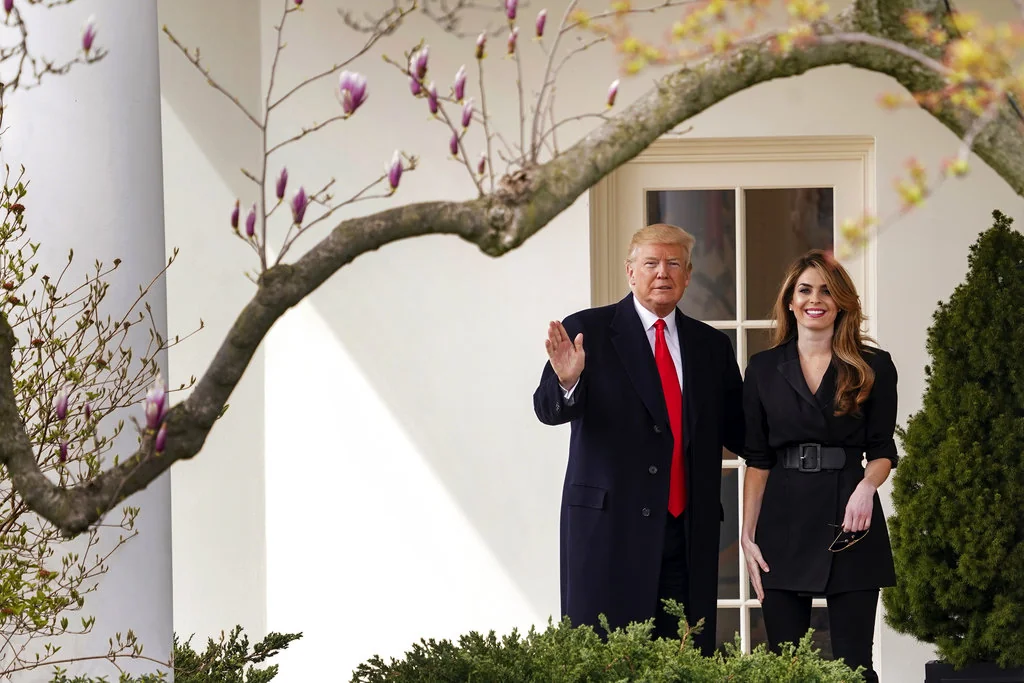 President Donald Trump waves with outgoing White House Communications Director Hope Hicks before boarding Marine One on the South Lawn of the White House in Washington, Thursday, March 29, 2018, for a short trip to Andrews Air Force Base, Md., and then on to Cleveland.