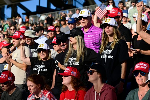 FORT COLLINS, CO - SEPTEMBER 18, 2025: Lynne Miller, left, Pat Flinn, center left, Abbie Flinn, center right, and Beth Lemiskho, right, cheer for Charlie Kirk Thursday, Sept. 18, 2025, during a Turning Point USA Vigil for Kirk at Colorado State University in Fort Collins. They are all wearing t-shrts they made for a security service Pat and Abbie Flinn want to start for conservative and Christian events. (Jenny Sparks/Loveland Reporter-Herald)