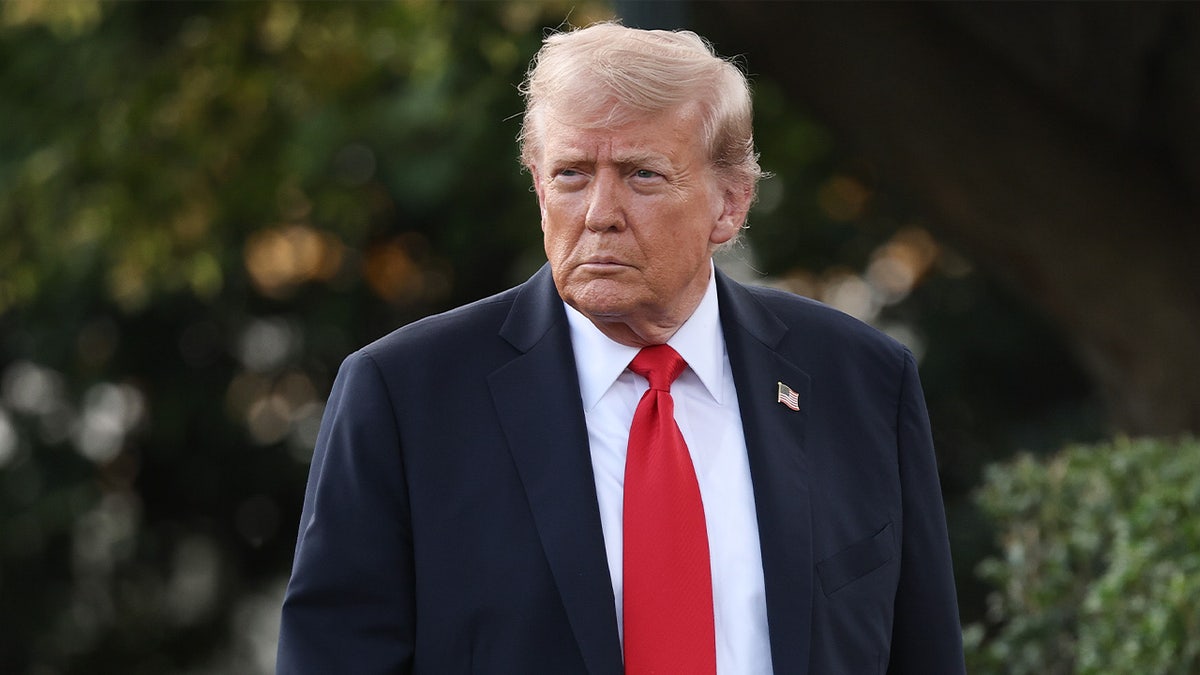 Donald Trump walking on White House lawn 