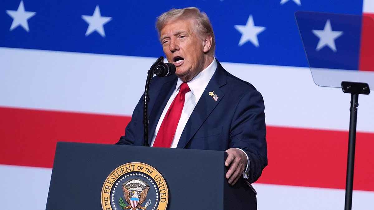 Donald Trump speaking to military senior leaders with American flag backdrop