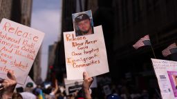 NEW YORK, NEW YORK - APRIL 19: A person holds a sign with a photo of Kilmar Abrego Garcia as people take part in a protest organised to