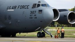 A US Air force flight carrying deported migrants by the US government arrives at Ramon Villeda Morales International Airport on January 31 in San Pedro Sula, Honduras.