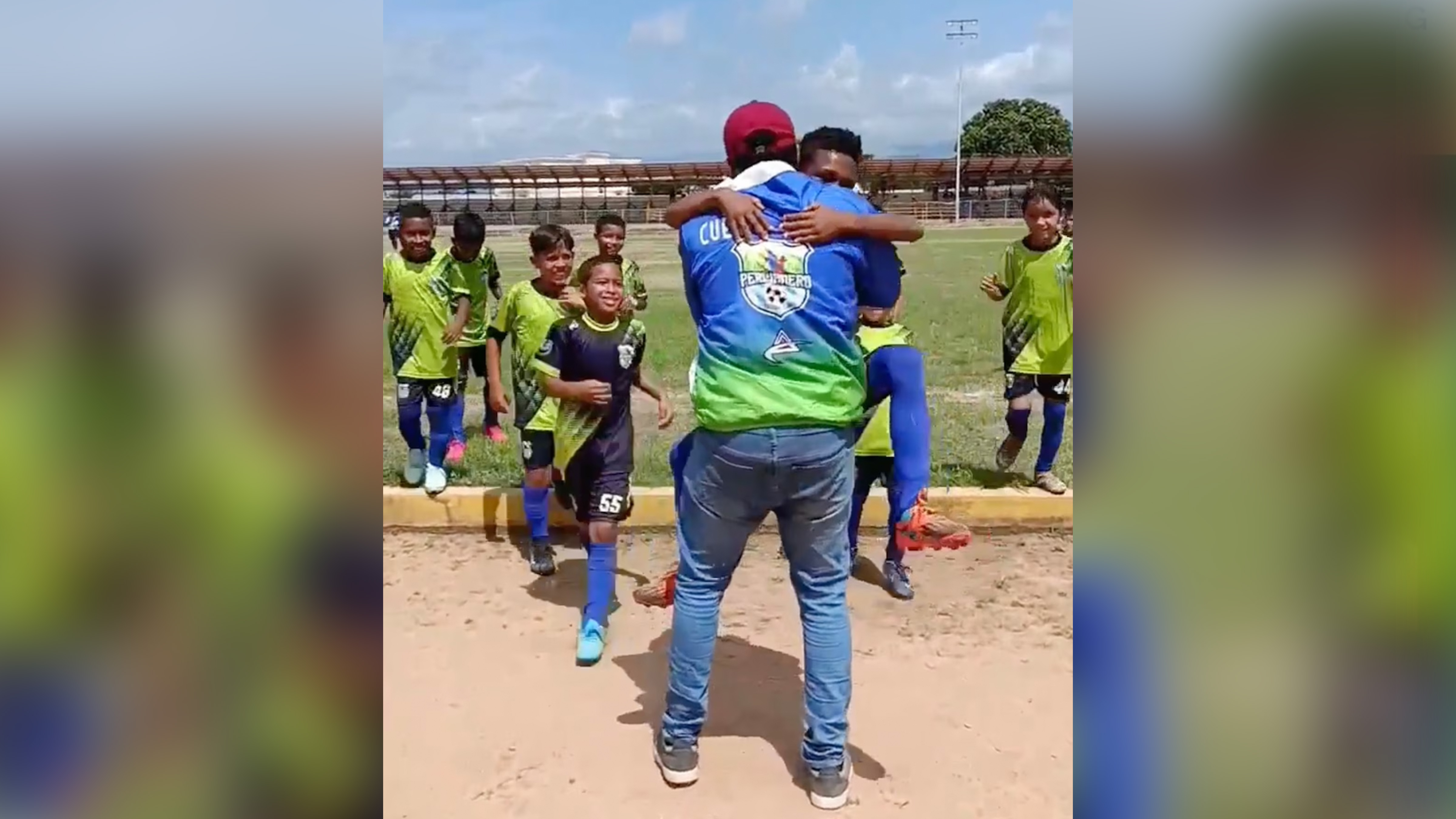 Jerce Reyes Barrios is greeted by members of his youth soccer team in Venezuela, July 23, 2025.