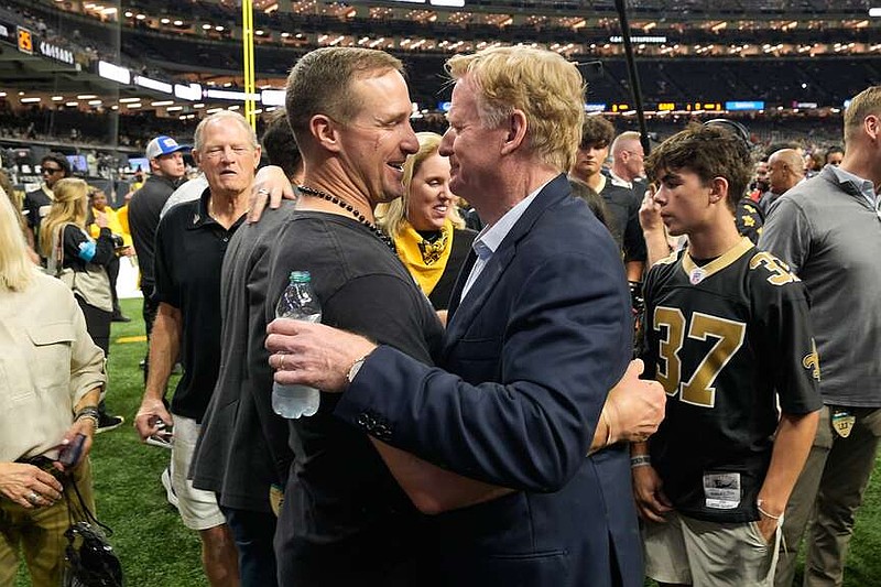 Former New Orleans Saints quarterback Drew Brees, middle left, greets NFL Commissioner Roger Goodell before an NFL football game between the Saints and the Atlanta Falcons in New Orleans, Monday, Oct. 5, 2026. (AP Photo/Gerald Herbert)