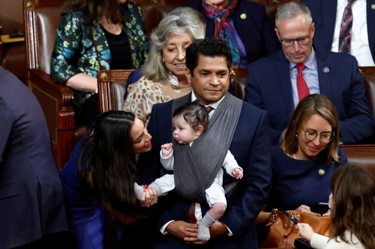Rep. Alexandria Ocasio-Cortez, holds Rep. Jimmy Gomez