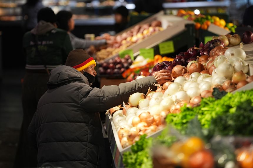 Customers shop at the Reading Terminal Market in Philadelphia on October 29, 2025.