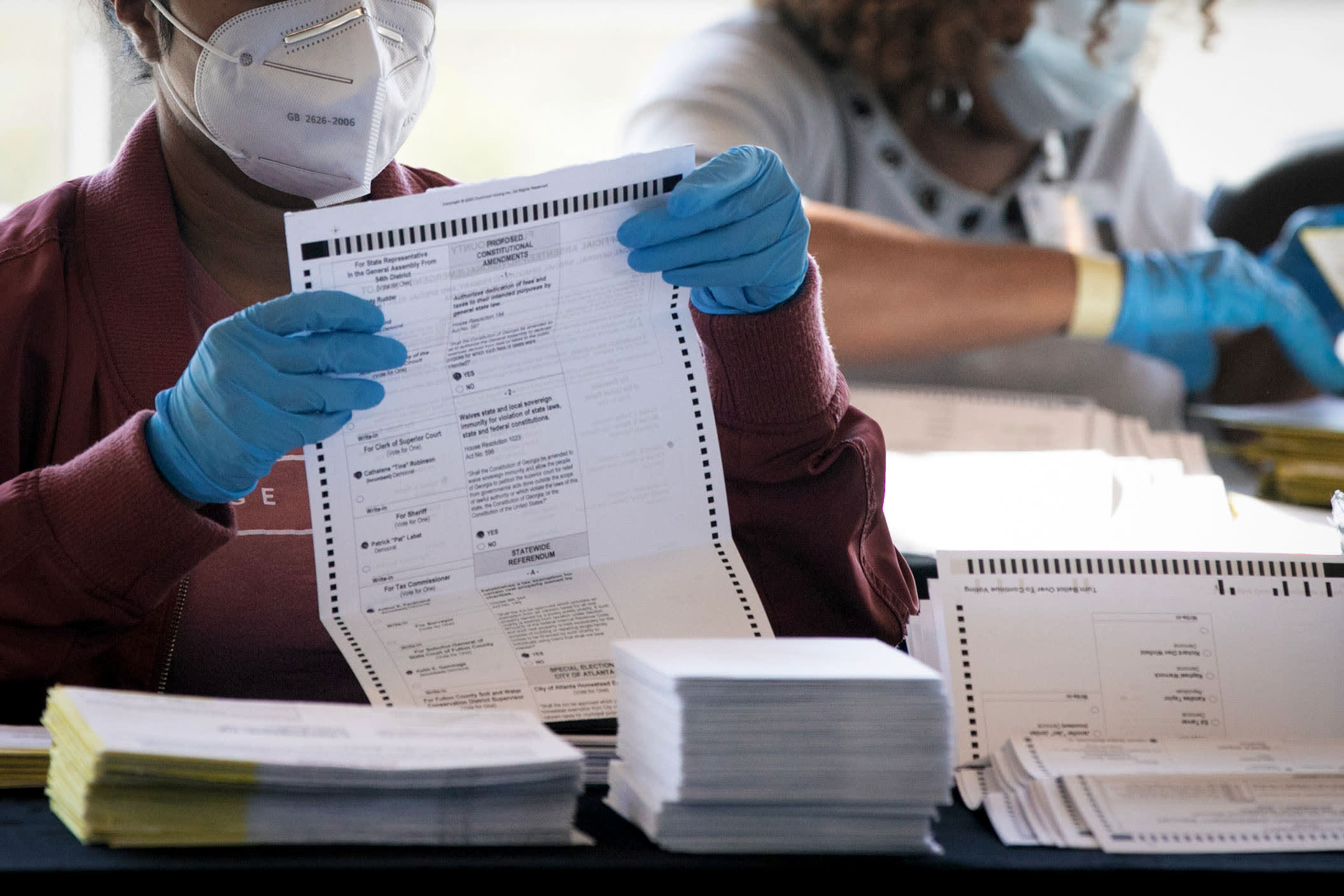 Election workers count Fulton County ballots at State Farm Arena on Nov. 4, 2020 in Atlanta, Ga.