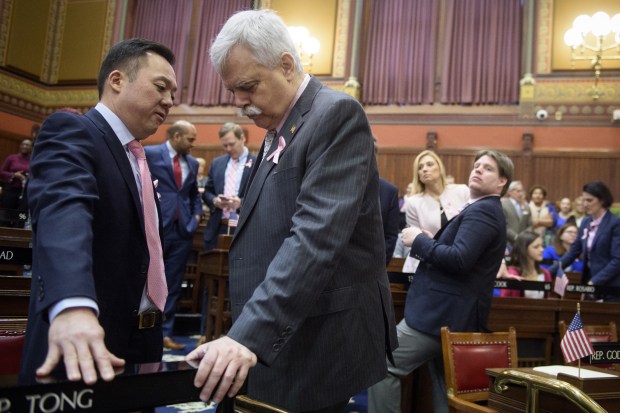 Deputy House Speaker pro tempore Bob Godfrey says the state has made major strides in gun safety laws over the past 37 years. Here, he speaks in 2018 with Democrat William Tong, who is now state attorney general, on the floor of the House.