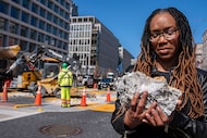 Tears roll down the face of Starlette Thomas, of Bowie, Md., as she holds a chunk of...