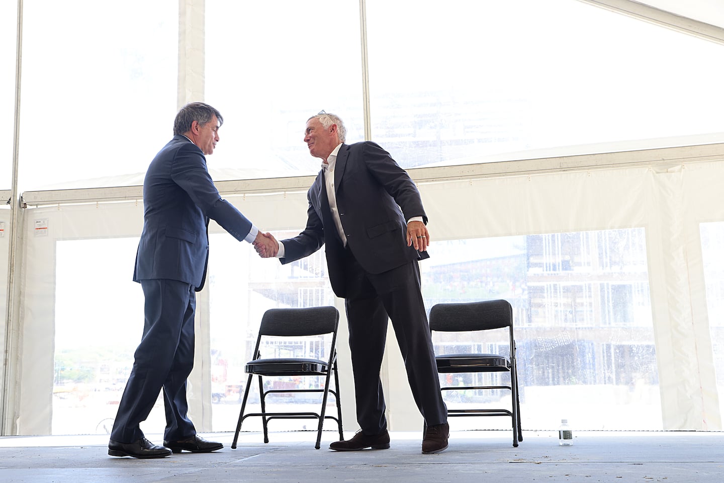 Larry Gottesdiener (at right) with Newton Mayor Marc Laredo at the topping-off ceremony for Northland's Pattern District development.
