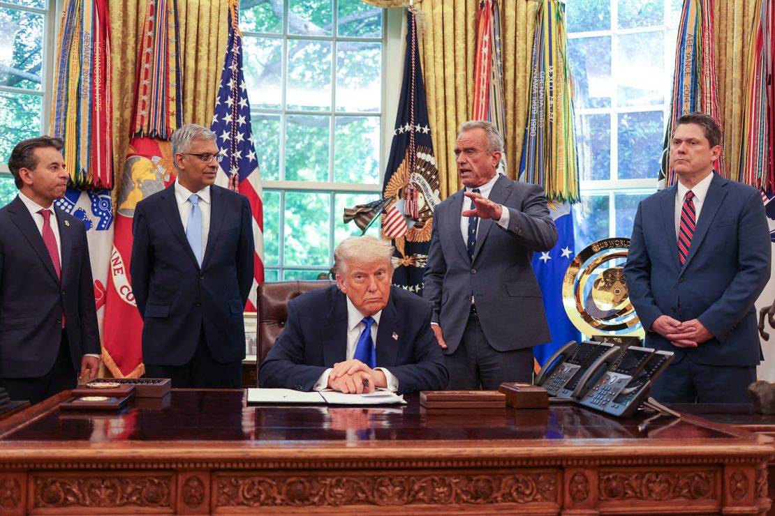 US Secretary of Health and Human Services Robert F. Kennedy Jr. speaks alongside Food and Drug Administration Commissioner Martin Makary, Director of the National Institutes of Health Jayanta Bhattachary, President Donald Trump, and speechwriter and political advisor Vince Haley during an executive orders signing event in the Oval Office of the White House in Washington, DC, on May 5.